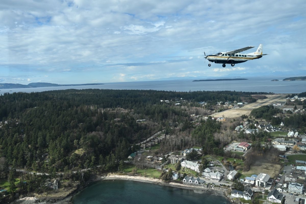 Cessna Caravan flying over Eastsound on Orcas Island